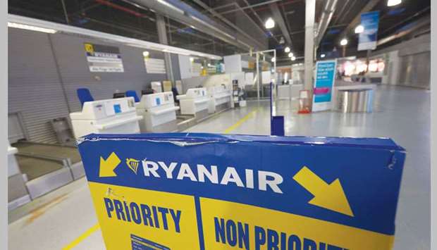 Empty Ryanair check-in desks are seen at the Frankfurt-Hahn Airport in Hahn, western Germany, as pilots of the company staged a strike.