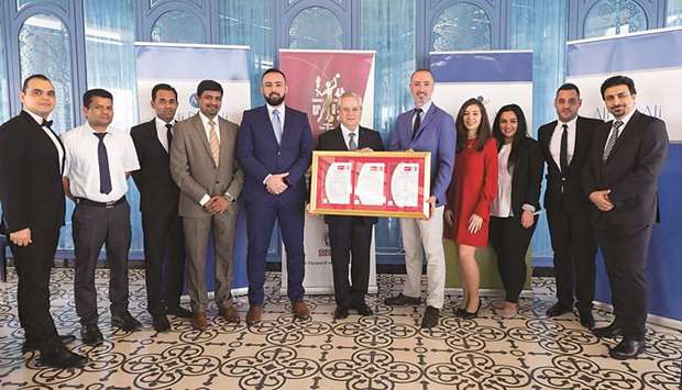 ABA Hospitality general manager Philippe Tardieu receiving the certificate from Bureau Veritas Qatar CEO Selim Kseib during the awarding ceremony.