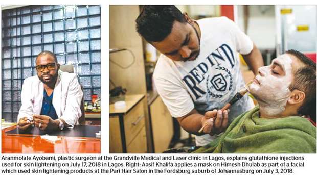 Aranmolate Ayobami, plastic surgeon at the Grandville Medical and Laser clinic in Lagos, explains glutathione injections used for skin lightening on July 17, 2018 in Lagos. Right: Aasif Khalifa applies a mask on Himesh Dhulab as part of a facial which used skin lightening products at the Pari Hair Salon in the Fordsburg suburb of Johannesburg on July 3, 2018.