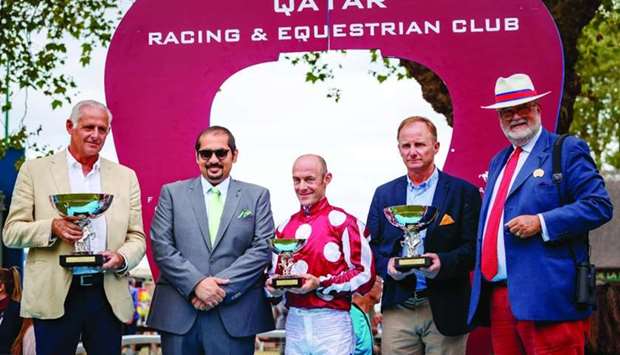 Qatar Racing and Equestrian Club (QREC) general manager Nasser bin Sherida al-Kaabi (second from left) poses with the winners of the Al Rayyan Cup - Prix Kesberoy (Gr1 PA) after His Highness Sheikh Abdullah bin Khalifa al-Thani-owned Marid won the 2000m race at Deauville in France Saturday. His Highness Sheikh Mohamed bin Khalifa al-Thani's Rajeh too emerged as a winner at the race meeting, topping Doha Cup-Prix Manganate (Gr1 PA).