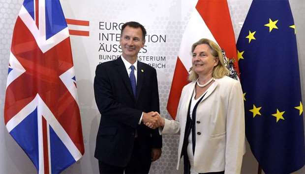 Britain's Foreign Minister Jeremy Hunt shakes hands with Austria's Foreign Minister Karin Kneissl