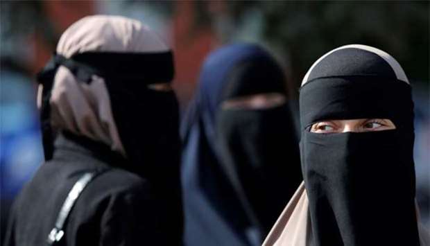Women in niqabs gather before a demonstration against the Danish face veil ban in Copenhagen on Wednesday.