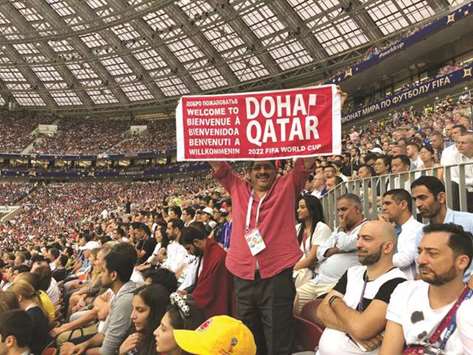 Dr Mohan Thomas at the stadium holding a u2018Welcome to Qataru2019 banner during the final of Russia 2018.