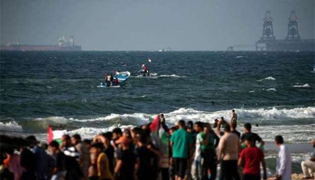 Palestinians steer their boat as they protest against Israel's naval blockade of Gaza, in Beit Lahya on the border with Israel, on Saturday.