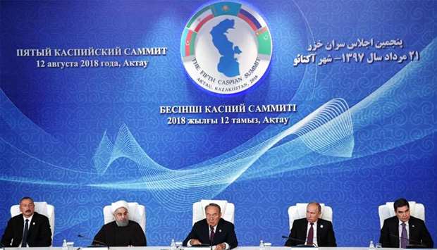 (L-R) Azerbaijan's President Ilham Aliyev, Iranian President Hassan Rouhani, Kazakhtan's President Nursultan Nazarbayev, Russian President Vladimir Putin and Turkmenistan's President Gurbanguly Berdymukhamedov attend the signing ceremony at the 5th Caspian Summit