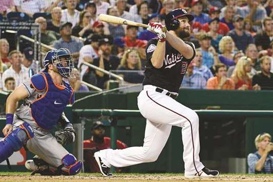 Washington Nationals second baseman Daniel Murphy hits a three run homer during the third inning against the New York Mets in Washington. (USA TODAY Sports)