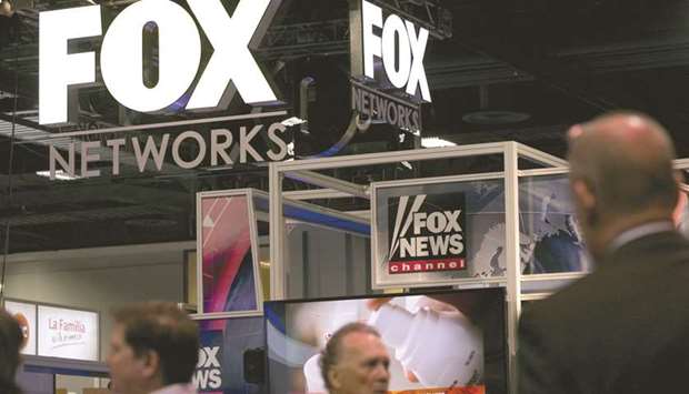 The logo of Fox Networks Group is seen on the exhibit floor during the National Cable and Telecommunications Association (NCTA) Cable Show in Washington, DC (file). Fox regional sports networks hold television rights to 44 professional basketball, baseball and hockey teams, including the Green Bay Packers and the Atlanta Braves.