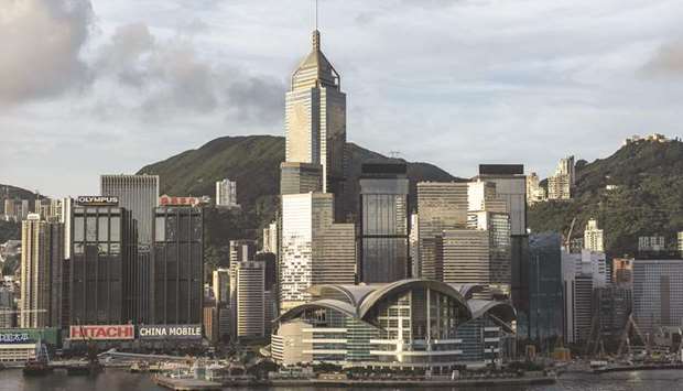 The Hong Kong Convention and Exhibition Centre and other commercial and residential buildings standing on Hong Kong island. Hong Kong economic growth slowed in the second quarter, amid a deepening US-China trade conflict and rising interest rates that are weighing on the outlook.