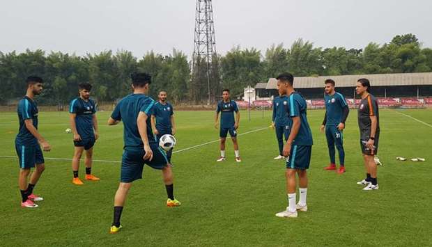 Qataru2019s Under-23 football squad train at the Pakansari Stadium, west of Jakarta, yesterday.