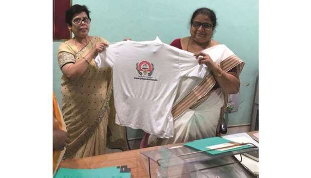 LAUNCH: Jyotshna Ranjan, left, with Dilmani Mishra, Chairperson of Bihar Women Commission, during the launch of her foundationu2019s shirt.
