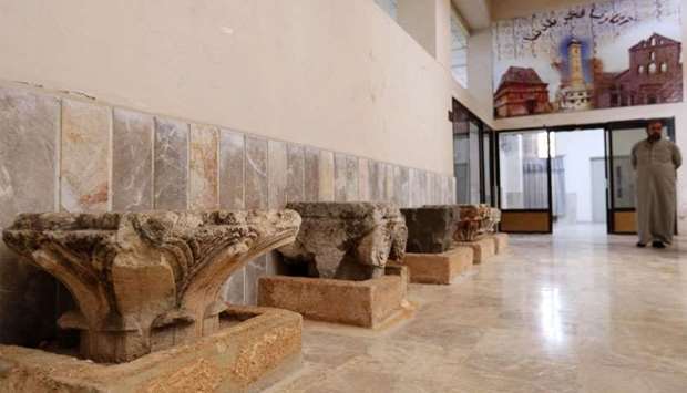 A man strolls at the Idlib Museum after it reopened in the northern Syrian city of Idlib