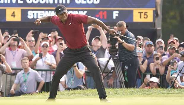 Tiger Woods celebrates after making a birdie putt on the 18th green during the final round of the PGA Championship golf tournament at Bellerive Country Club. PICTURE: Jerry Lai-USA TODAY Sports