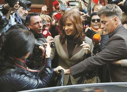 Former Argentine president Cristina Kirchner leaves her apartment on her way to a court in Buenos Aires yesterday.