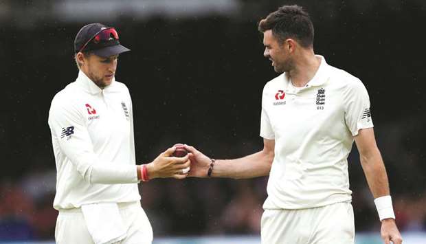Englandu2019s Joe Root (left) with James Anderson during the fourth day of Lordu2019s Test. (Reuters)