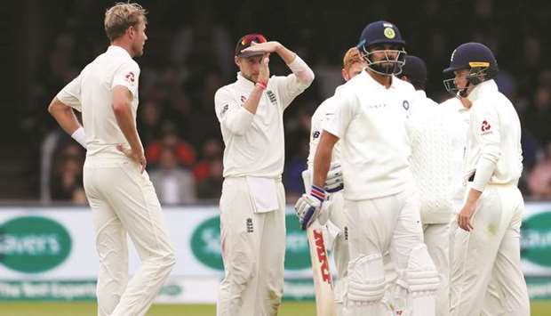 Englandu2019s Joe Root signals to review a decision on Indiau2019s Virat Kohli during the fourth day of Lordu2019s Test. (Reuters)