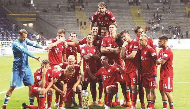 Bayern Munich players celebrate after winning the German Supercup in Frankfurt on Sunday. (AFP)