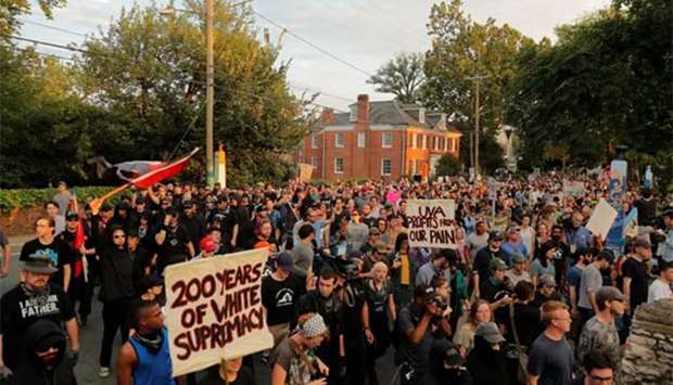 Protesters march at the University of Virginia in Charlottesville on Saturday evening.