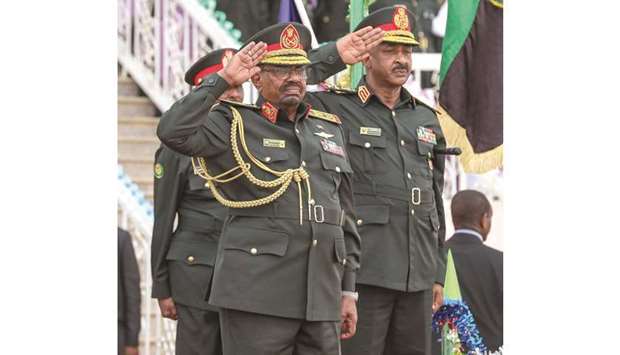 Sudanese President Field Marshal Omar Hassan Ahmad al-Bashir receiving salute during the military parade.
