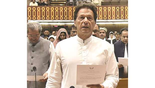This image made available by the Pakistan Press Information Department (PID) yesterday shows Pakistan Tehreek-e-Insaf (PTI) chief Imran Khan taking his oath as a Member of Parliament during the first session of parliament in Islamabad.