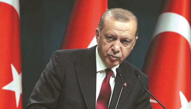 Turkish President Recep Tayyip Erdogan attends a news conference in Ankara yesterday. He says Turkey is the target of an economic war, and has made repeated calls for Turks to sell their dollars and euros to shore up the national currency.