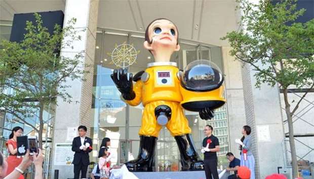 The ,Sun Child, artwork is seen at an unveiling ceremony in Fukushima.