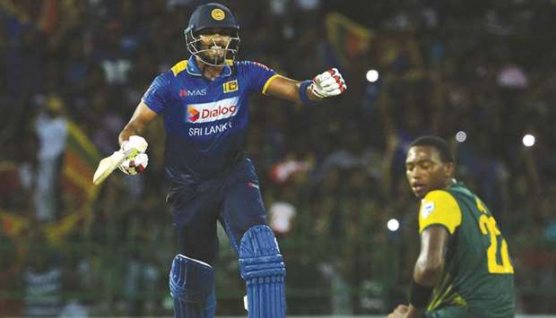 Sri Lankau2019s Dinesh Chandimal celebrates their victory against South Africa in the Twenty20 match at the R. Premadasa Stadium in Colombo yesterday. (AFP)