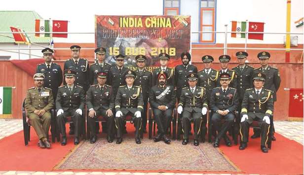 Members of the Indian army and Chinese People Liberation Army meet on the occasion of the 72nd Independence Day in Bumla of Arunachal Pradesh yesterday.