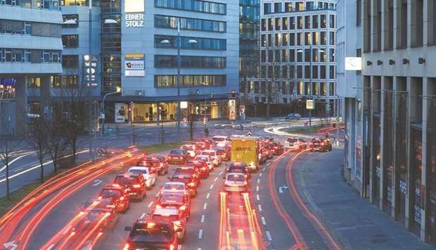 Automobiles leave light trails at dusk on a city centre road in Stuttgart. Germanyu2019s GDP rose 0.5% quarter-on-quarter in April-June, the Federal Statistics Office said on Tuesday.