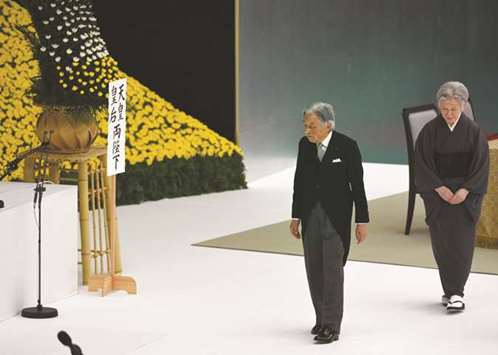 Japanu2019s Emperor Akihito and Empress Michiko walk towards the altar during the annual official memorial service for war victims in Tokyo yesterday, on the 73rd anniversary of Japanu2019s defeat in World War II.