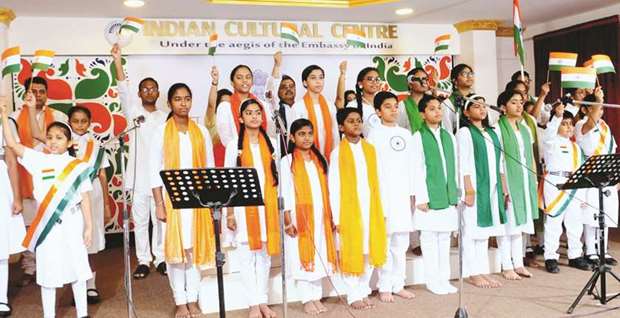 Schoolchildren present a patriotic song on the occasion.