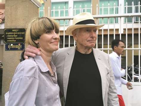 Hollywood director Peter Weir (right) leaves the court in Phnom Penh after testifying in the trial of detained Australian filmmaker James Ricketson yesterday accompanied by Alexandra Kennett the partner of Ricketsonu2019s son Jesse Ricketson.