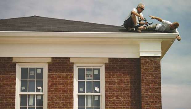 Contractors install gutters on a house under construction in Louisville, Kentucky. Housing starts rose 0.9% to a seasonally adjusted annual rate of 1.168mn units in July, the Commerce Department said yesterday.