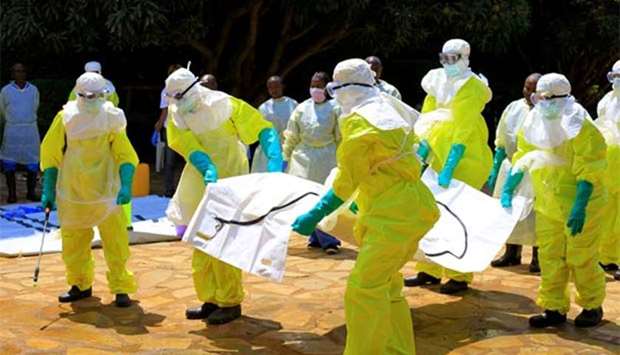 Congolese and World Health Organisation officials wear protective suits as they participate in a training against the Ebola virus near the town of Beni in North Kivu province of the Democratic Republic of Congo last week.