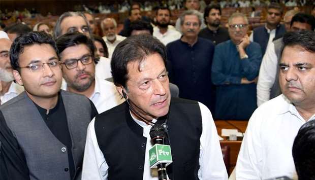 Imran Khan (C), chairman of Pakistan Tehreek-e-Insaf (PTI) political party speaks after he was elected as Prime Minister at the National Assembly (Lower House of Parliament) in Islamabad