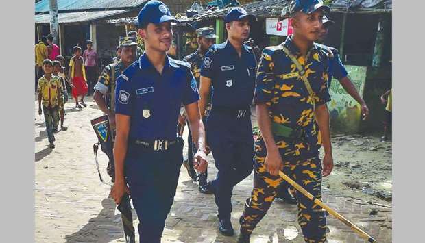 Bangladeshi police patrolling in a Rohingya refugee camp in Teknaf.