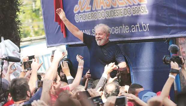 Former Brazilian president Luiz Inacio Lula da Silva is carried by supporters in front of the metallurgic trade union in Sao Bernardo do Campo, Brazil, in a file photo.