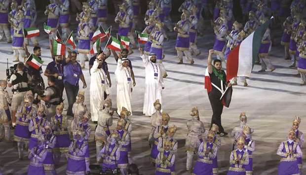 Kuwaiti delegation takes part in the 2018 Asian Games opening ceremony yesterday. (Reuters)