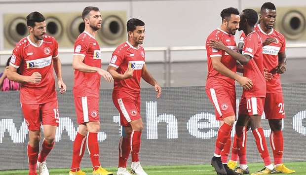 Al Arabiu2019s Mudhir Abdrabo (third right) celebrates with his teammates after scoring against Al Kharaitiyat in the QNB Stars League at Al Sadd stadium yesterday.