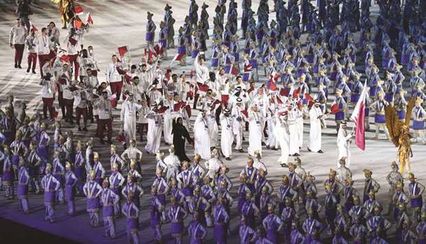 Team Qataru2019s athletes takes part in the parade during the opening ceremony of the 2018 Asian Games at the Gelora Bung Karno Stadium in Jakarta, Indonesia, yesterday. (AFP)
