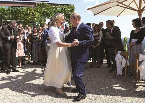 Kneissl and Putin dance during her wedding yesterday.