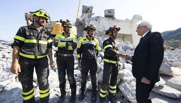Italian President Sergio Mattarella visits the site of the bridge collapse in Genoa on Saturday.