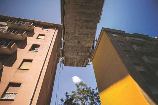 This picture taken this week shows apartment buildings in Genoa under the Morandi motorway bridge, days after a section collapsed.