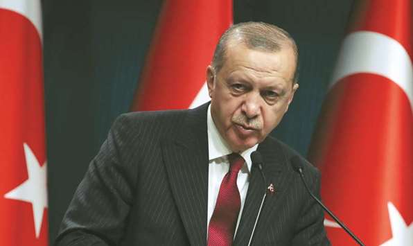 Turkish President Tayyip Erdogan attends a news conference in Ankara last week. u201cThose who think they can make Turkey give in with the exchange rate will soon see that they are mistaken,u201d he said yesterday.