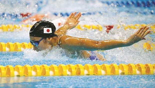 Japanu2019s Rikako Ikee (also inset) in action during the womenu2019s 50m Butterfly swimming event at in Jakarta, Indonesia, yesterday. (Reuters)