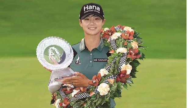 Park Sung-Hyun of South Korea with a wreath and the winneru2019s trophy after winning the Indy Women In Tech Championship Driven by Group 1001 at the Brickyard Crossing Golf Club in Indianapolis, Indiana. (Getty Images/AFP)