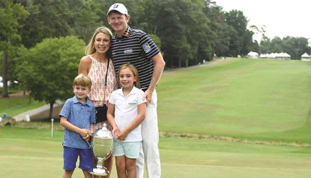 Brandt Snedeker poses with his wife Mandy and children Austin and Lily after winning Wyndham Championship at Sedgefield Country Club.  PICTURE: USA TODAY Sports