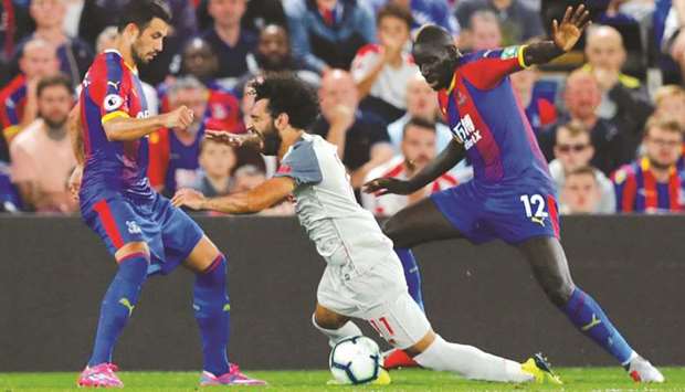 Crystal Palaceu2019s Mamadou Sakho (right) concedes a penalty after the defender fouled Liverpoolu2019s Mohamed Salah in the Premier League in London on Monday night. (Reuters)