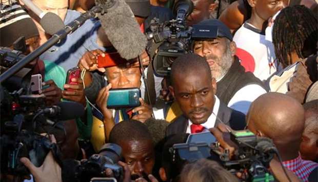 Opposition Movement For Democratic Change (MDC) leader Nelson Chamisa addresses members of the media at a hospital where people injured in post-election clashes are being treated in Harare on Thursday.