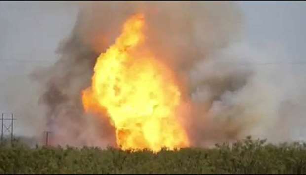 A pipeline explosion erupts in this image captured from video by a field worker in Midland County, home to the Permian Basin and the largest US oilfield, on Wednesday.