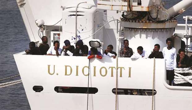 Migrants on board the Italian coast guard vessel Diciotti at the port of Catania.